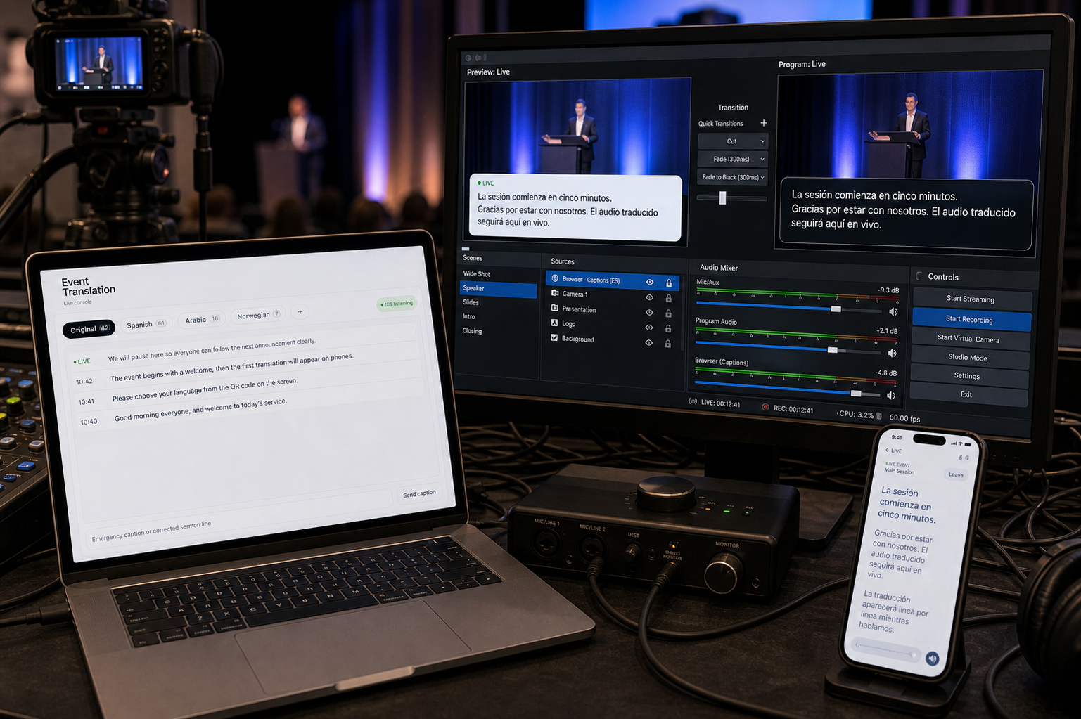 A laptop and phone showing live captions on a livestream.